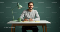 Smiling Man Writing at Modern Desk in Cozy Home Office