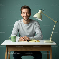 Smiling Man at Cozy Workspace with Wooden Desk
