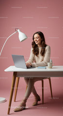 Smiling Woman Working at Minimalist Desk in Pink Home Office
