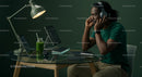 Man Working at Modern Home Office Desk with Tech Gadgets