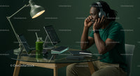 Man Working at Modern Home Office Desk with Tech Gadgets
