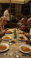 Group Enjoying Italian Cuisine at Outdoor Restaurant