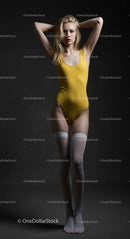 Elegant Model in Yellow Bodysuit Posing in Studio