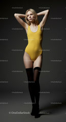 Confident Fashion Model in Yellow Bodysuit and Black Stockings