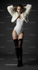 Elegant Woman in White Bodysuit and Fur Jacket