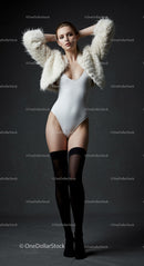 Fashion Model Posing in Chic White and Black Attire