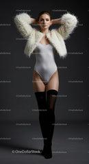 Fashion Model in White Fur Jacket and Black Stockings
