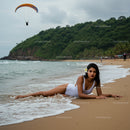 Relaxed Woman in Swimsuit on Tropical Beach with Paraglider