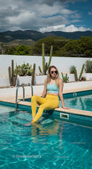 Woman Enjoying a Sunny Day by the Pool with Cacti