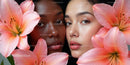 Elegant Portrait of Two Women Surrounded by Pink Lilies