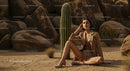 Elegant Woman in Desert with Cactus