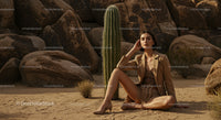 Elegant Woman in Desert with Cactus