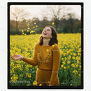 Joyful Woman in Yellow Field of Blooming Flowers