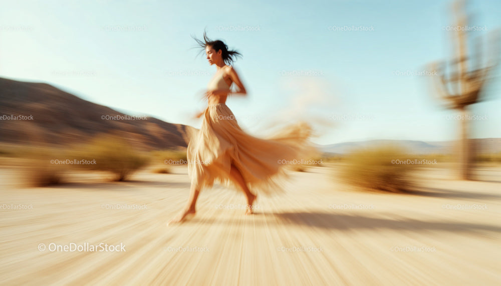 Woman in Flowing Dress Running Through Desert