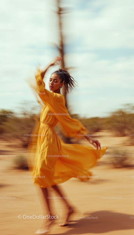 Woman in Yellow Dress Dancing in Desert Landscape