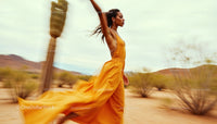 Elegant Woman in Flowing Dress Running Through Desert