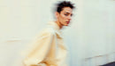 Dynamic Portrait of a Modern Trendsetter in Beige