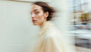 Dynamic Portrait of a Woman in Motion on City Street