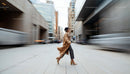 Businesswoman in Motion on a Busy City Street