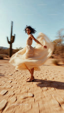 Graceful Woman Dancing in Flowing Beige Dress in Desert