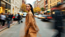 Elegant Woman in Autumn Coat on Busy City Street