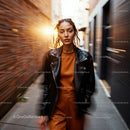 Stylish Woman Walking in City Alley at Sunset