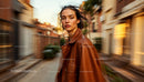 Stylish Woman in Leather Jacket Walking on Urban Street