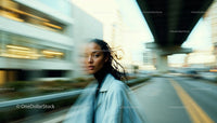 Dynamic Urban Portrait of Young Woman with Motion Blur
