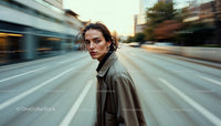 Stylish Woman in Trench Coat on Urban Street at Sunset