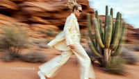 Stylish Woman in Beige Suit Walking Through Desert