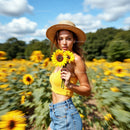 Blonde Woman in Sunflower Field with Straw Hat