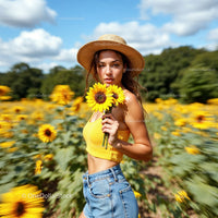 Blonde Woman in Sunflower Field with Straw Hat