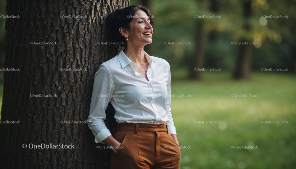 Smiling Woman in White Shirt with Brown Pants in Park