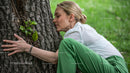 Woman Embracing Tree in Peaceful Outdoor Environment