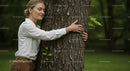 Woman Embracing Tree in Tranquil Park Setting