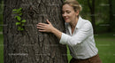 Woman Embracing Tree in Peaceful Park Setting