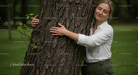 Woman Embracing Tree in Green Park Setting