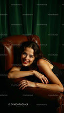 Smiling Woman Relaxing on Brown Leather Chair
