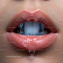 Close-Up of Sensual Lips with Ice Cube and Water Droplets