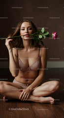 Woman in Lingerie Holding a Pink Rose with Elegance