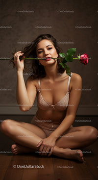 Sensual Woman with Rose in Intimate Setting