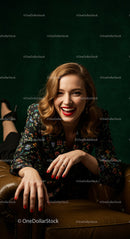Smiling Woman in Floral Blazer on Leather Couch