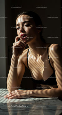 Elegant Woman in Shadows with Sunlit Contemplation