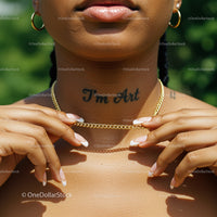 Elegant Gold Necklace and Tattoo on Sunlit Skin