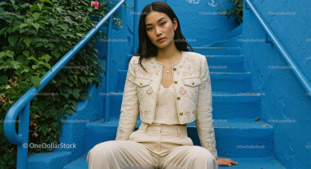 Stylish Woman Sitting on Blue Stairs