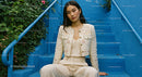 Stylish Woman Sitting on Blue Stairs