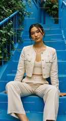 Stylish Woman in Elegant Outfit on Blue Stairs