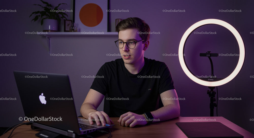 Young Professional in Modern Home Office with Laptop