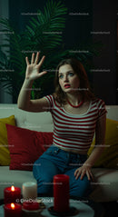 Young Woman in Striped Shirt with Red Lipstick and Candles