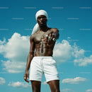 Confident Male Model in White Headscarf Against Blue Sky